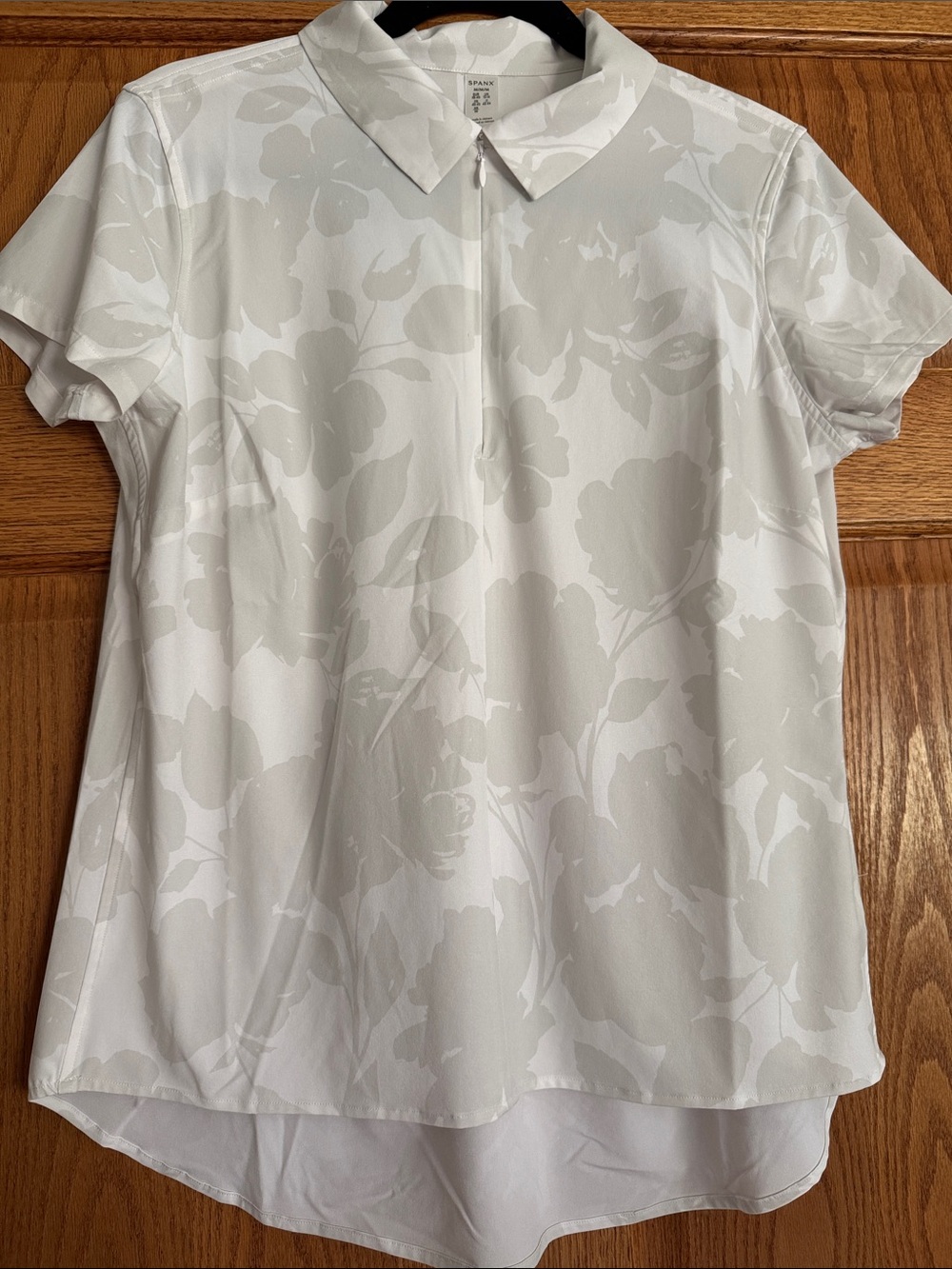 SPANX White Floral  Short-Sleeve Zip   Hi/Lo top.